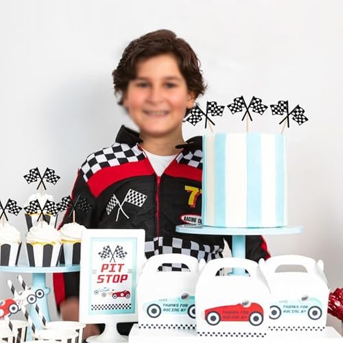 Party table display featuring checkered racing flag toppers in cupcakes