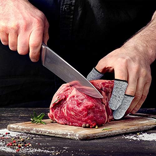 Breathable fingertip guards being used for safe kitchen food cutting and chopping