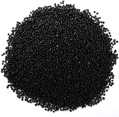 Natural black crystal chips in a decorative glass vase