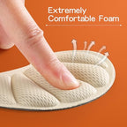 Close up of breathable foam material and adhesive backing on shoe pads.
