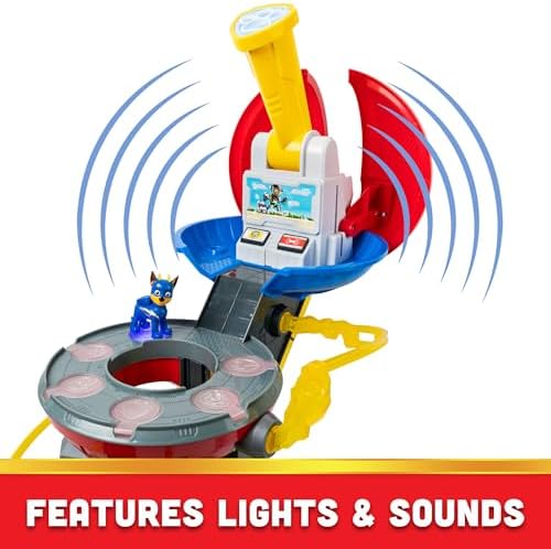 Side profile of the interactive tower showing a pup figure sliding down the integrated zipline accessory for rescue play.