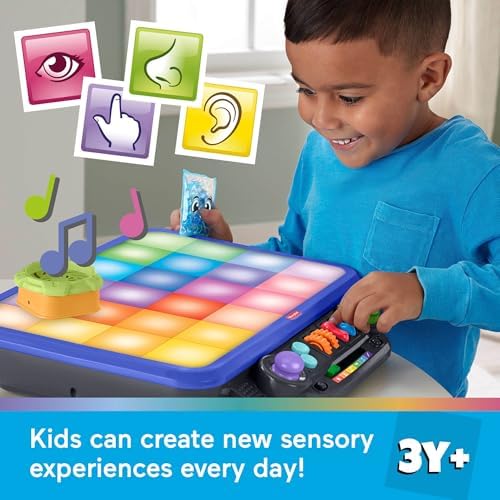 Close-up view of the textured buttons, dials, and tactile switches on the Fisher-Price learning toy station tabletop.