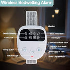 Ovevve bed wetting alarm kit including stickers and progress tracking card.