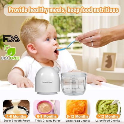 Compact glass puree machine blending fresh organic vegetables on a kitchen counter