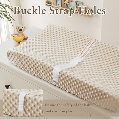 Close up view of the textured fleece minky dots on the baby changing table cover