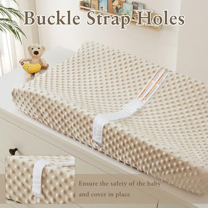 Close up view of the textured fleece minky dots on the baby changing table cover