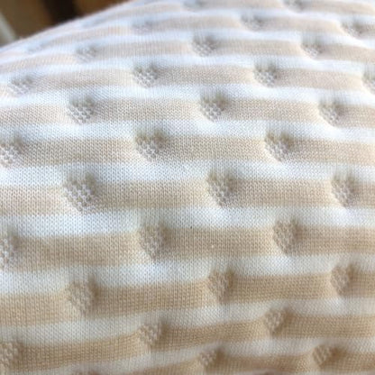 Lifestyle shot of Tiny Undies waterproof baby changing pad on bed