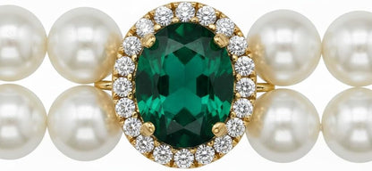 Close up view of the emerald green gemstone charm and adjustable metal extension chain on the Hotlion pet necklace.
