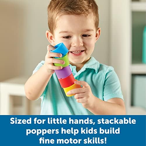 Toddler hands interacting with the blue sad emotion popper showing the tactile bubble popping mechanism in action