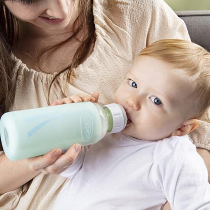 Side profile of a narrow glass baby bottle with mint silicone sleeve applied