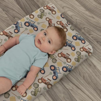 Side angle view of fitted tractor changing table sheet