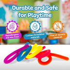 Five colorful IMPRESA sensory stretchy strings laid out flat to display the variant colors.