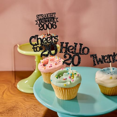 Assorted black glitter theme birthday cupcake topper set shown on standard sized baked treats.