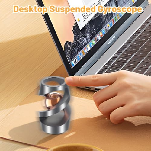Hand holding the kinetic spinning desk fidget toy