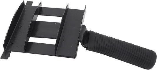 Cattle grooming comb with black non slip ribbed rubber handle close up
