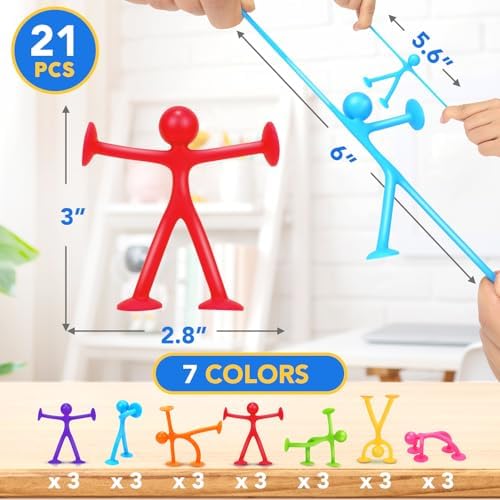 Humanoid suction fidget toys attached to a glass window