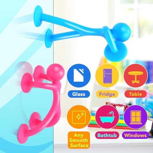 Colorful humanoid suction toys stuck to a window