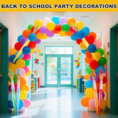 Oversized 41 inch orange inflatable paintbrush balloon used as a backdrop prop for graduation ceremonies.