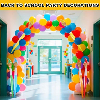 Oversized 41 inch orange inflatable paintbrush balloon used as a backdrop prop for graduation ceremonies.