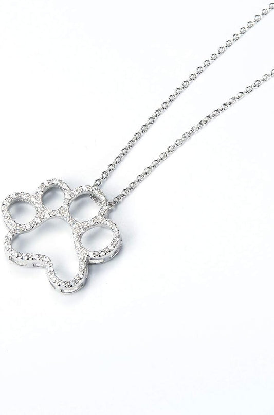 ONEFINITY sterling silver dog paw pendant with shimmering cubic zirconia stones close up view