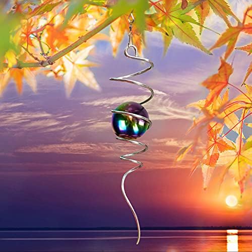 Kinetic wind spinner hanging in a garden setting