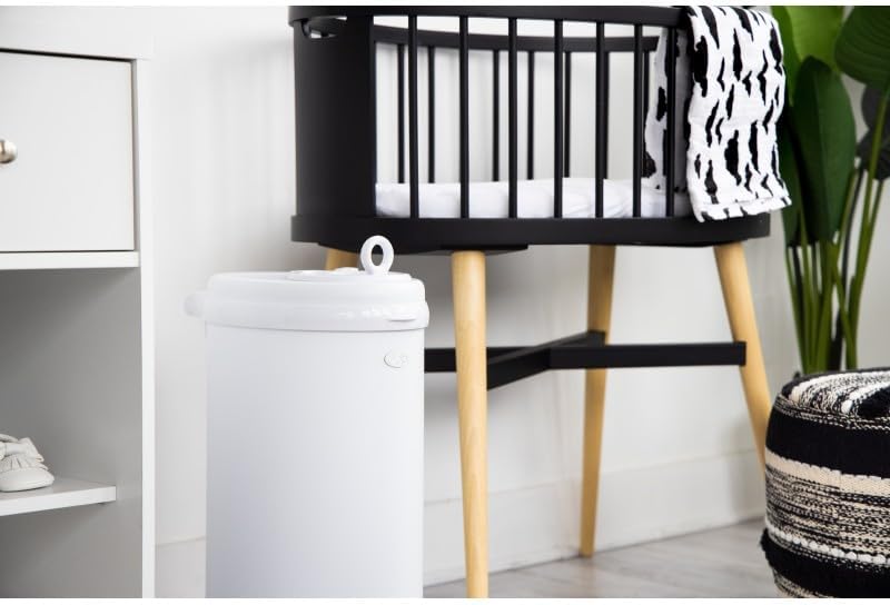 Ubbi steel diaper disposal system detail shot of safety lock and handle