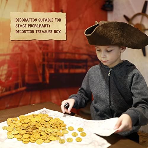 Kids hands holding imported pirate adventure treasure toy coins.