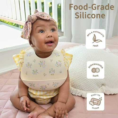 Two pack of Little Rawr waterproof silicone bibs in modern gender neutral colors