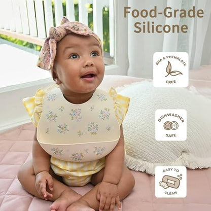 Two pack of Little Rawr waterproof silicone bibs in modern gender neutral colors