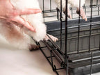 The Paw Saver dog kennel threshold protector in black medium size preventing paw entrapment.