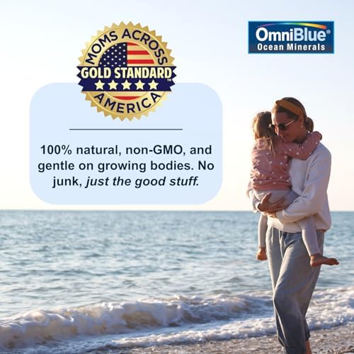 OmniBlue ocean minerals supplement being dropped into a fresh fruit smoothie.