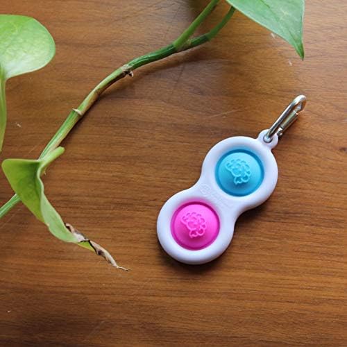 Close up view of authentic food grade silicone buttons on the pink and blue Simpl Dimpl