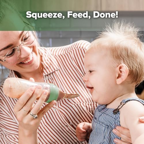 Infant squeeze cereal feeder bottle close up displaying the soft silicone spoon attachment.