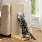 Vertical wall-leaning cat scratching board positioned next to a living room sofa