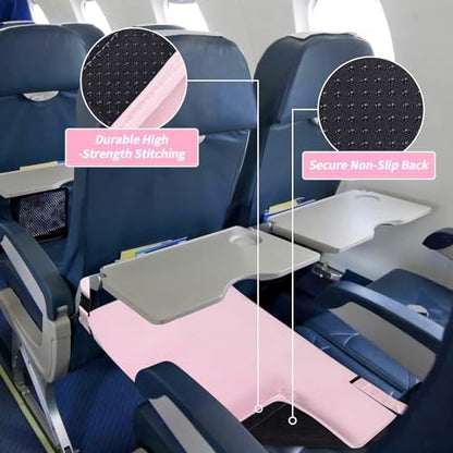 Side view of the pink velvet AWAHITAWA airplane bed bridging the gap between economy class seats.