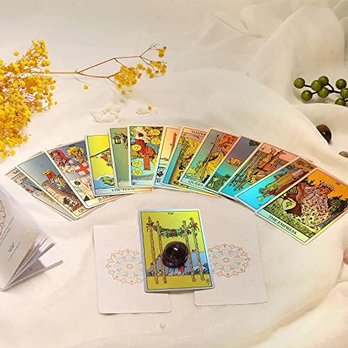 Full 78 card holographic tarot deck spread on table