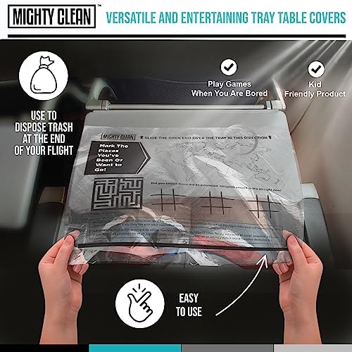 Disposable tray protector being folded up into a convenient trash bag with flight wrappers inside.