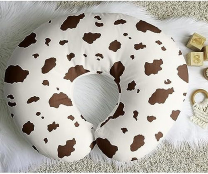 Detailed view of stretch jersey fabric texture on cow print pillow cover