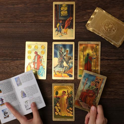 Close up of gold foil detailing on tarot card