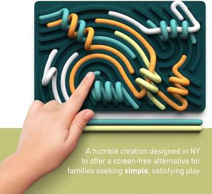 Close up view of a hand pushing a blue flexible string into the channels of the silicone fidget toy for motor skill development