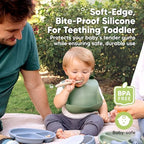 BPA free food grade silicone baby spoons laid out on a kitchen table.