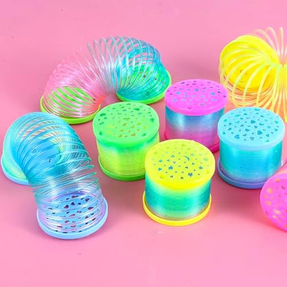 A child holding the 2.1 by 1.7 inch mini slinky toy demonstrating its flexible stretching capability.