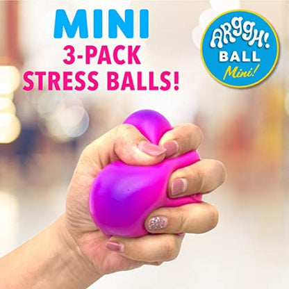 A hand squeezing the pink sensory toy to demonstrate the vibrant purple color transformation.