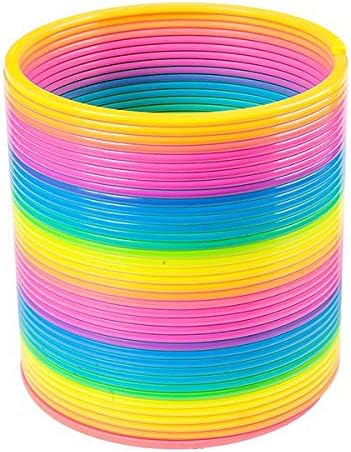 Vibrant multicolor plastic coil spring walking down a set of indoor stairs