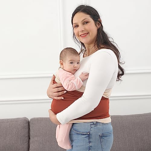 Side view of an infant resting in an ergonomic M-position inside a natural color baby sling