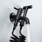 Flexible coiled hose connected to the high-pressure toilet sprayer set.