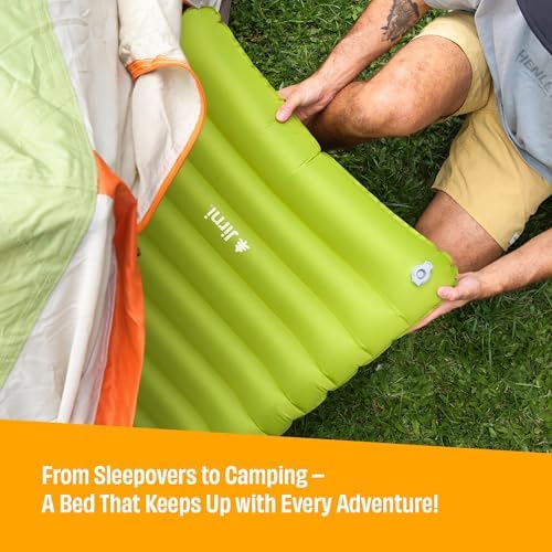 Jirni eco friendly inflatable kids travel bed set up inside a family camping tent.