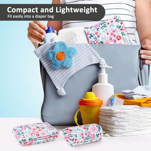 Baby lying on floral print waterproof changing pad liner