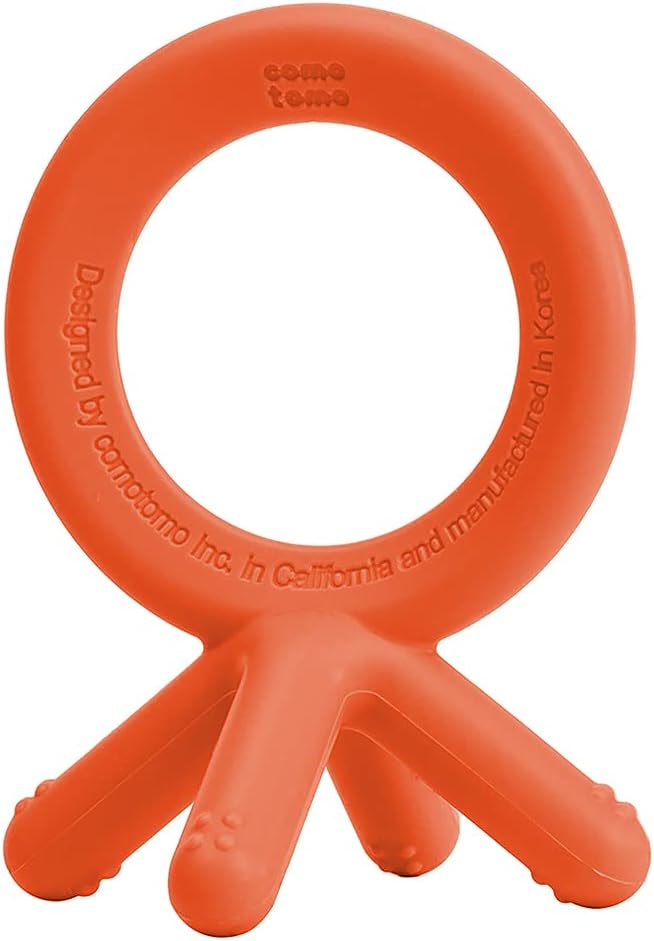 Comotomo blue silicone baby teether showing the compact size for little hands