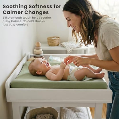 Konssy gender neutral changing table sheets installed inside a modern nursery room